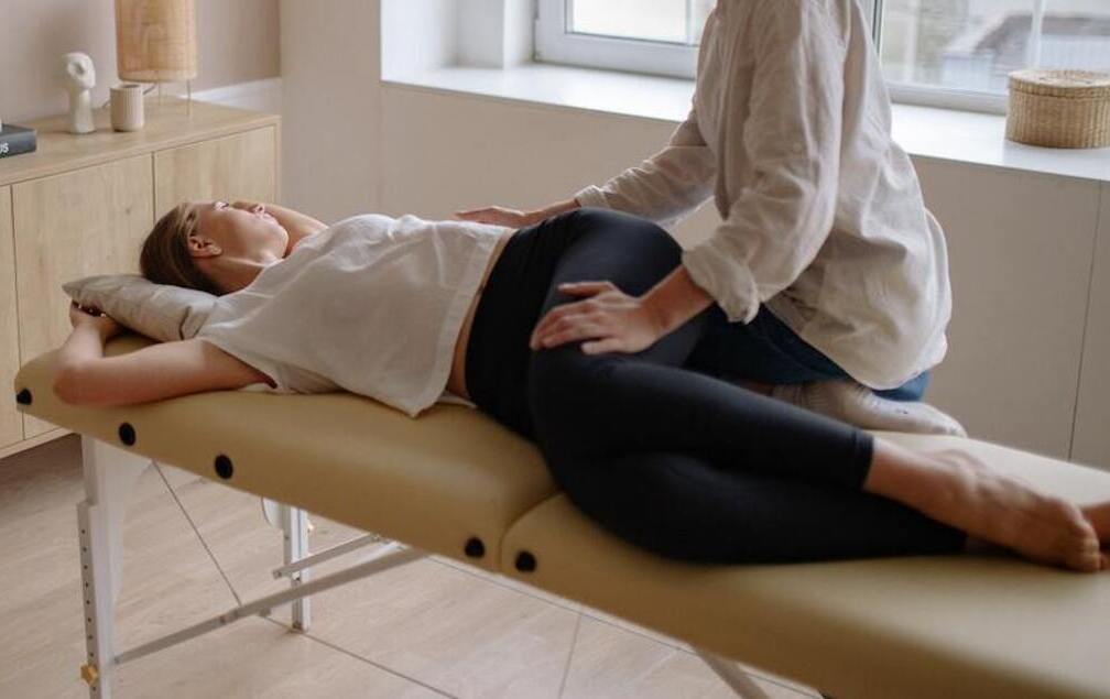 Woman having A Chiropractic Adjusment Done